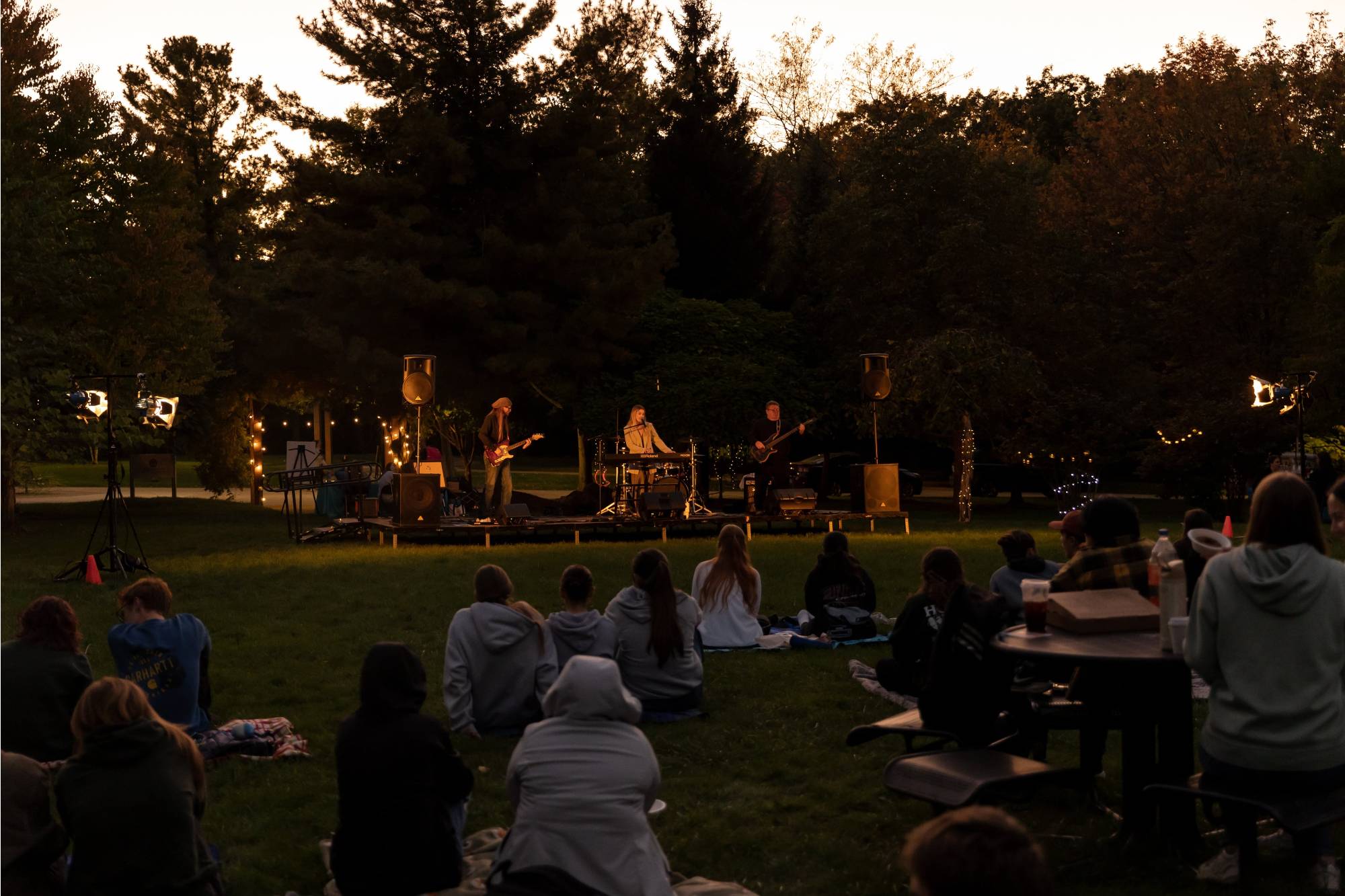 Izzy joy and band performing at night